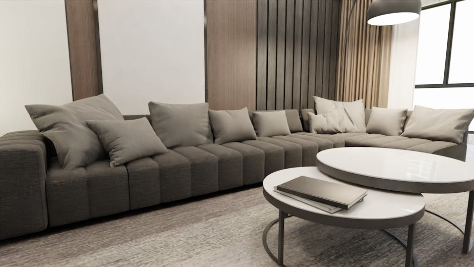 Cozy living room with a large gray sofa and stylish round tables in Scandinavian design.